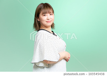 Chubby young woman business casual plus size model 103545438