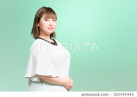 Chubby young woman business casual plus size model 103545443