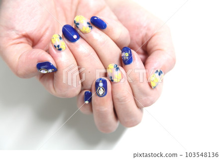 Nail deco of navy blue with rhinestone navy blue and yellow floral pattern Nail deco of navy blue with rhinestone navy blue and yellow floral pattern 103548136