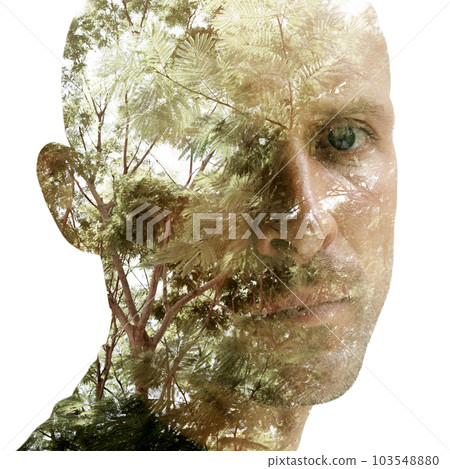 Double exposure portrait of a man looking sadly into the camera Double exposure portrait of a man looking sadly into the camera 103548880