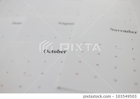 Calendar pages with autumn months names as background 103549503
