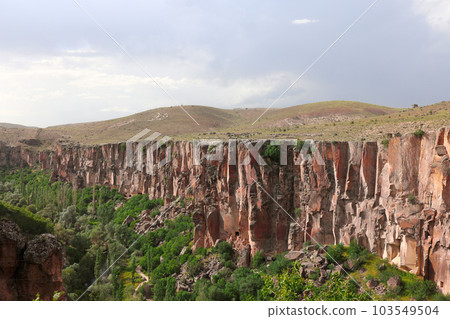 Canyon with steep rocks in Ihlara valley of Cappadocia Canyon with steep rocks in Ihlara valley of Cappadocia 103549504