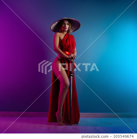 sexy girl in a red cape and an Asian hat with a katana in her hand in neon lights on a copy paste background sexy girl in a red cape and an Asian hat with a katana in her hand in neon lights on a copy paste background 103549674