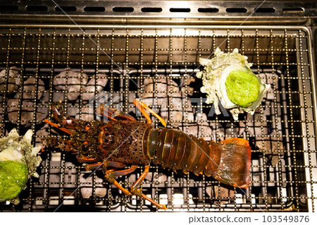 Fresh spiny lobster, charcoal-grilled turban shell with spiny lobster and basil sauce, barbecue, BBQ dinner (Chiba) 103549876