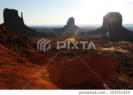 Colorado Plateau, Monument Valley in the morning, rocky hills rising in the backlight Colorado Plateau, Monument Valley in the morning, rocky hills rising in the backlight 103551854