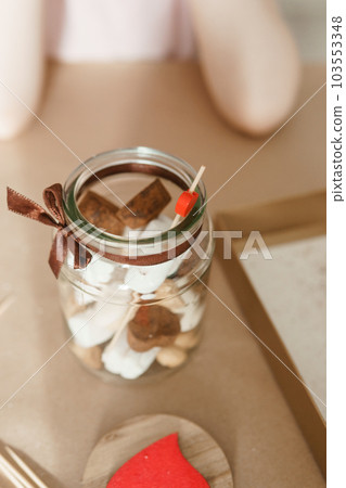 A little girl blogger makes a sweet Valentine's Day gift with her own hands. A gift for the holiday, a video blog entry. 103553348