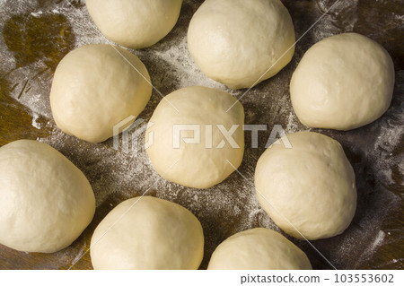 making bread and pizza dough 103553602