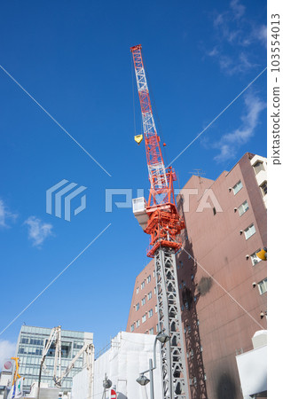 red crane under construction red crane under construction 103554013