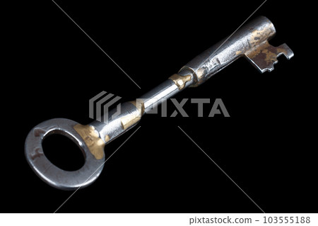 Old rusty key on a black. Old rusty key on a black. 103555188