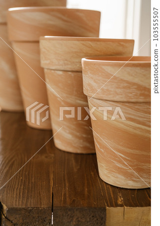 The texture of terracotta pots in close-up. The texture of terracotta pots in close-up. 103555507