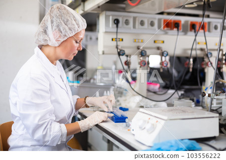 Young adult woman lab technician at work 103556222