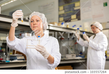 Shot of an adult woman using equipment to work in a laboratory Shot of an adult woman using equipment to work in a laboratory 103557264