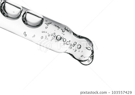 Transparent pipette with cosmetics on a white isolated background. Transparent pipette with cosmetics on a white isolated background. 103557429