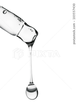 Transparent pipette with cosmetics on a white isolated background. Transparent pipette with cosmetics on a white isolated background. 103557430