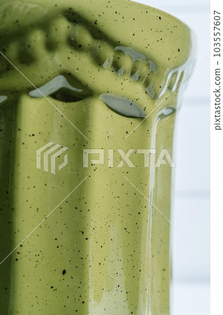 The texture of green glazed enamel. Abstract background. 103557607
