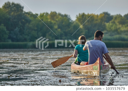 Canoe tour on a river Canoe tour on a river 103557679
