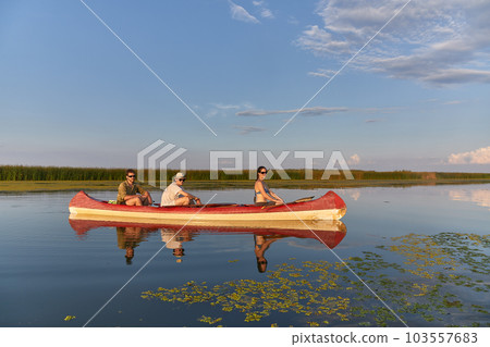 Canoeing on a lake Canoeing on a lake 103557683