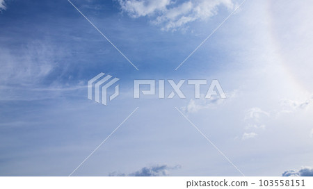 Clouds flowing in the blue sky in the daytime and colors by the sun 103558151
