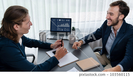 Busy analyst team in office analyzing financial data analysis. Entity Busy analyst team in office analyzing financial data analysis. Entity 103560115