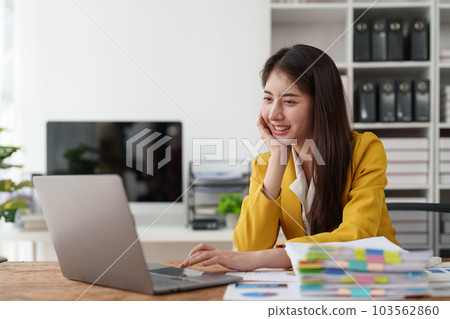 Asian Business person makes analysis and research financial report at office, analyzes profits. Accountant checks status of financial Asian Business person makes analysis and research financial report at office, analyzes profits. Accountant checks status of financial 103562860