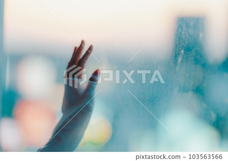 Young woman standing in the city sunset Young woman standing in the city sunset 103563566