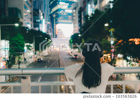 A young woman with headphones A young woman with headphones 103563826