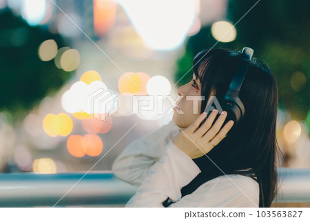 A young woman with headphones A young woman with headphones 103563827
