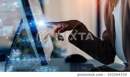 Foreign engineer and digital technology image using PC in the office 103564334