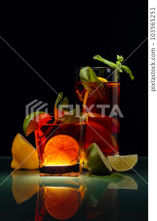 Ice tea with lemon, lime and mint. 103565251
