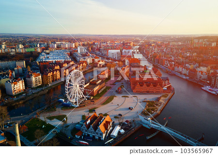 Aerial view of ferris wheel attraction in Gdansk city, Poland. Panoramic view of touristic place in european city 103565967