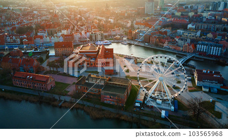 Aerial view of ferris wheel attraction in Gdansk city, Poland. Panoramic view of touristic place in european city Aerial view of ferris wheel attraction in Gdansk city, Poland. Panoramic view of touristic place in european city 103565968