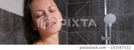 Portrait of beautiful young woman enjoying shower Portrait of beautiful young woman enjoying shower 103567332