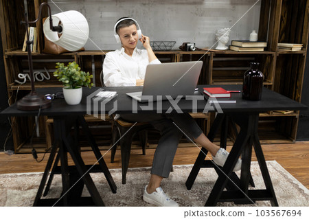 businesswoman broker working on a deal while sitting in the office 103567694