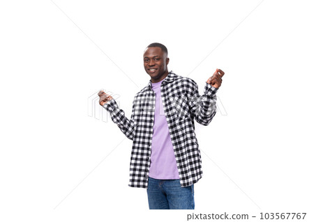 well-groomed pleasant young american guy with short hair dressed casually on a white background with well-groomed pleasant young american guy with short hair dressed casually on a white background with 103567767