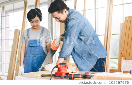 Southeast asian family father and son diy or repair for crafts skill at home workshop Southeast asian family father and son diy or repair for crafts skill at home workshop 103567976