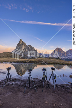 Camera on a tripod in the landscape, Giau Pass (Passo Giau), Dolomites Alps, South Tyrol, Italy 103569199