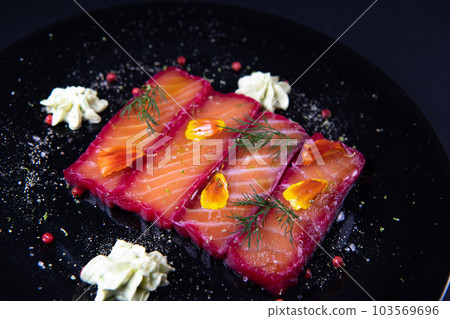 Recipe for gravlax salmon marinated with beet and avocado mayonnaise sauce 103569696