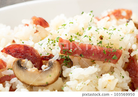 Salami and mushroom butter rice close-up. Salami and mushroom butter rice close-up. 103569950