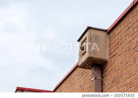 a rain drain on building 103571635