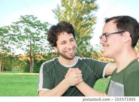 Two friends high-fives happily after working out 103571995