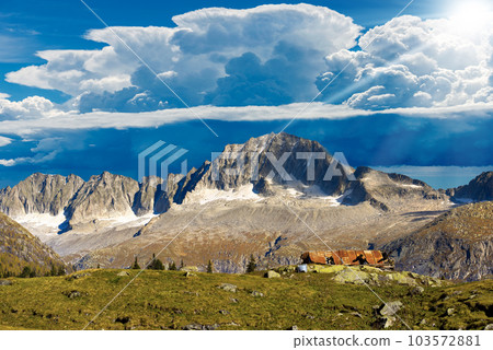 Mountain Peaks against Beautiful Storm Clouds - Trentino Italy 103572881
