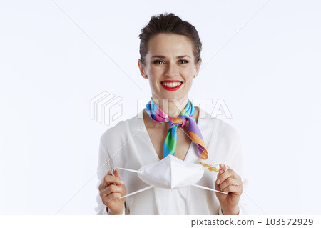 happy stylish female stewardess on white happy stylish female stewardess on white 103572929