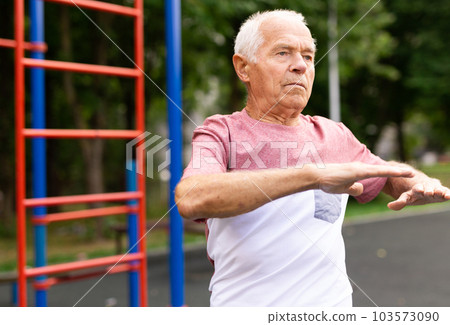 elderly man, engaged in sports 103573090
