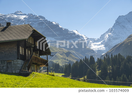 Switzerland Mountain valley Kiental, Berner Oberland Alps. Snow mountains, sunny weather, travel to Swiss. 103574009