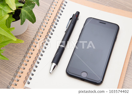 Notebook, ballpoint pen and smartphone Notebook, ballpoint pen and smartphone 103574402