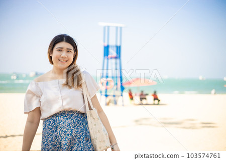 happy asian healthy plump woman travel at summer sea beach. portrait people smiling photograph happy asian healthy plump woman travel at summer sea beach. portrait people smiling photograph 103574761