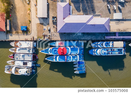Aerial view of tour boats moored at marina 103575008