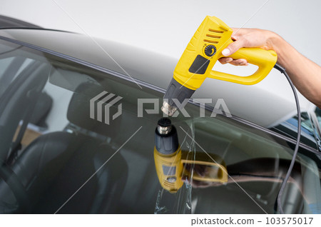 Car front window film removal and tinting installation Car front window film removal and tinting installation 103575017