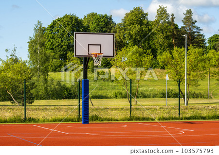 An outdoor community basketball court 103575793
