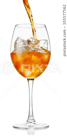 aperol spritz pouring in glass with ice isolated on white 103577562